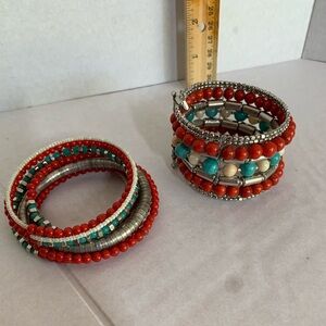 Two faux turquoise and coral bracelets. One memory wire. One cuff style